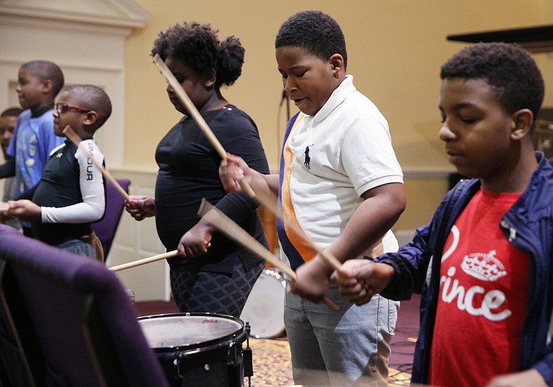 Toriyunna Matthews, 8, Gherison Strickland, 8, and Kaleb McNary, 13, work on a performance with the Unity Performing Arts Foundation Monday, Feb. 19, 2018 at Grace Pointe Church in Chattanooga, Tenn. The group will participate in a concert in recognition of Black History Month on Feb. 24.