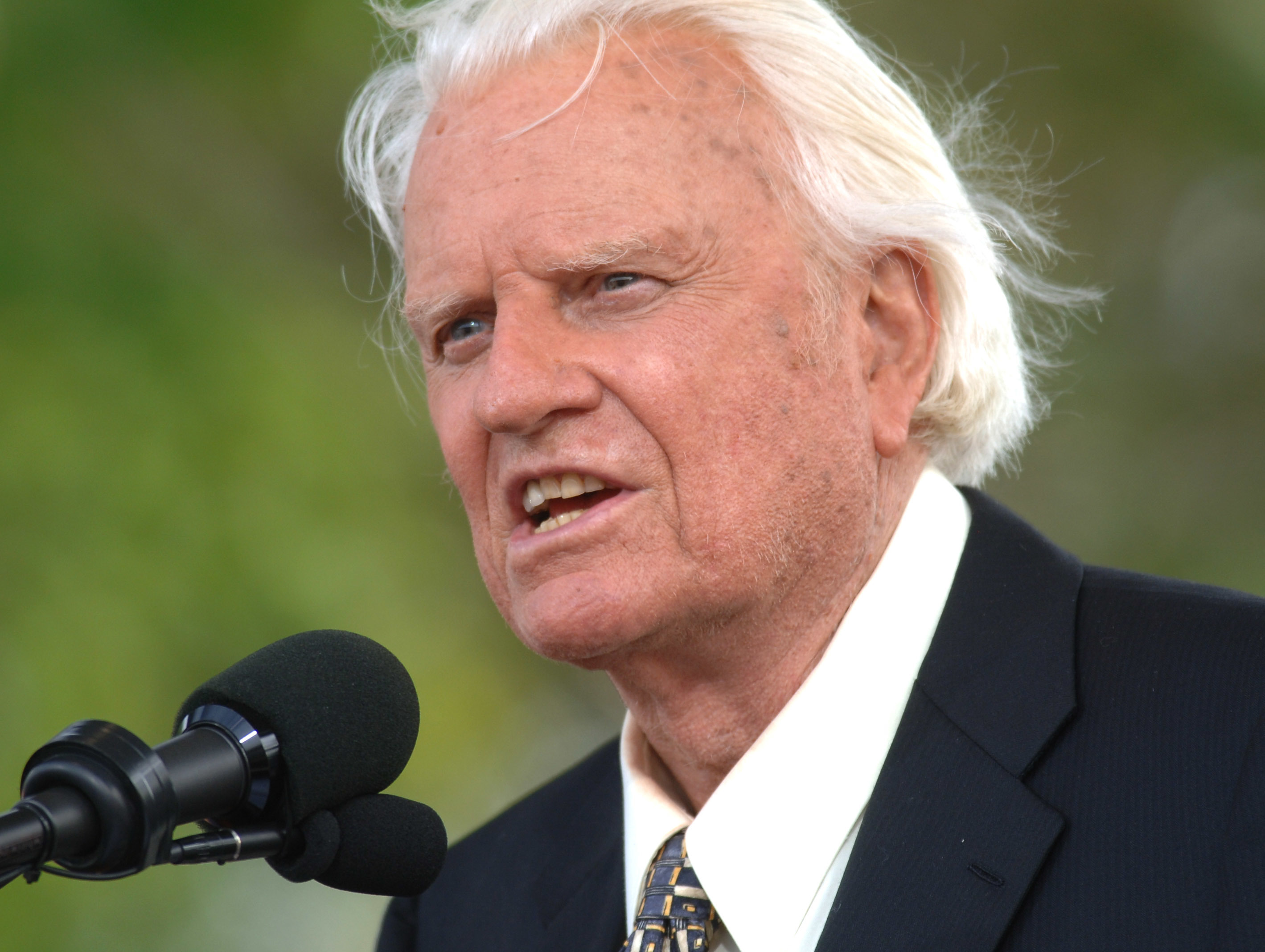 In this June 26, 2005, file photo, the Rev. Billy Graham speaks on stage on the third and last day of his farewell American revival in the Queens borough of New York. A spokesman said on Graham has died at his home in North Carolina at age 99. (AP Photo/Henny Ray Abrams)