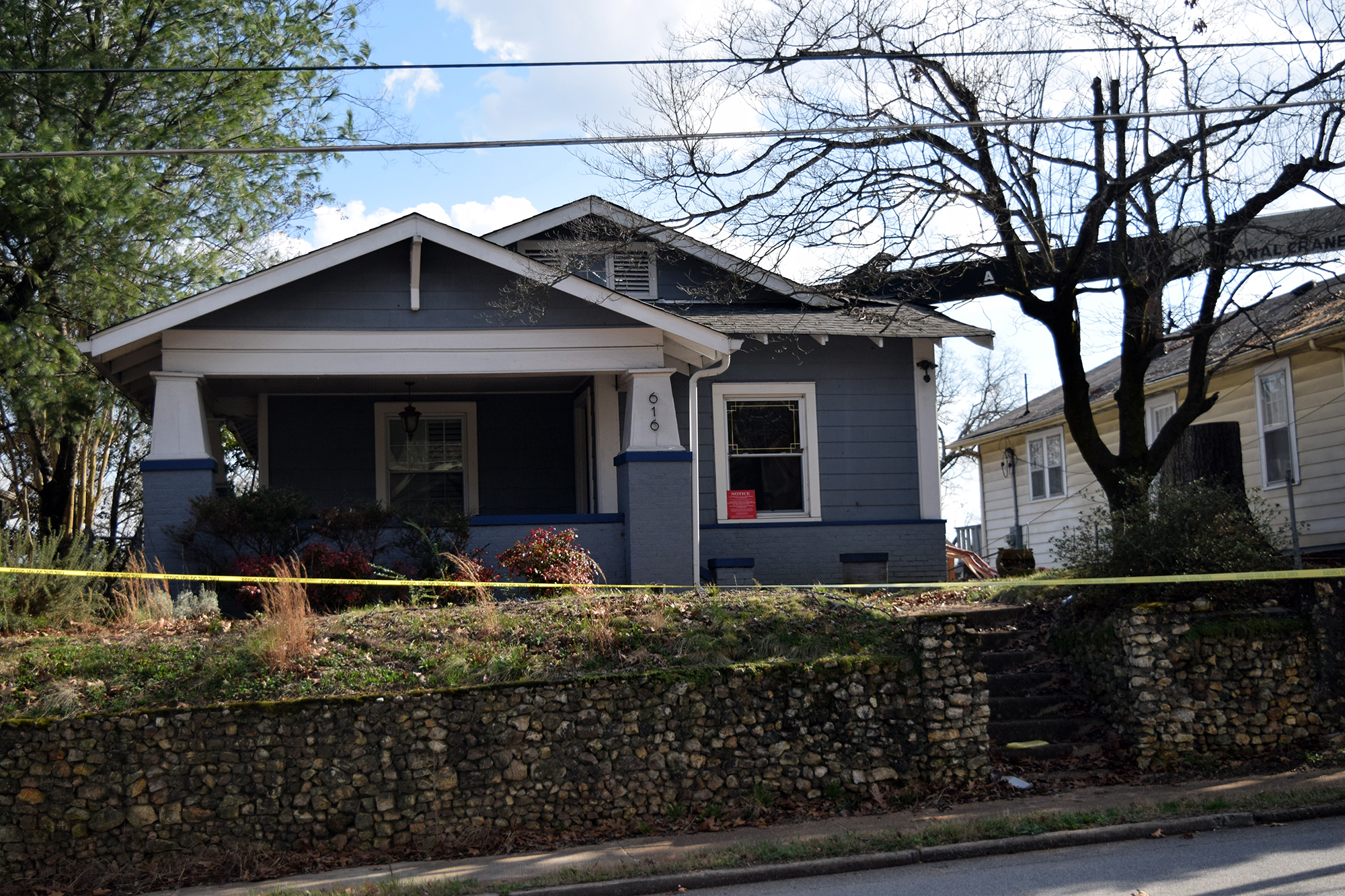 A truck with a crane doing tree work on the North Shore toppled over into two homes this afternoon.