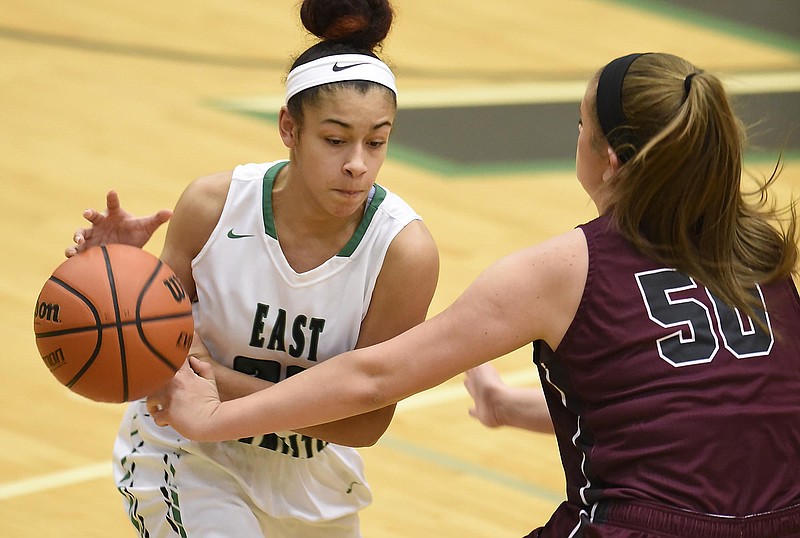 East Hamilton's Zhane' Johnson (23) has the ball knocked away by White County's Megan Anderson (50).  The White County Warriors visited the East Hamilton Hurricanes in girls's region TSSAA basketball on February 23, 2018