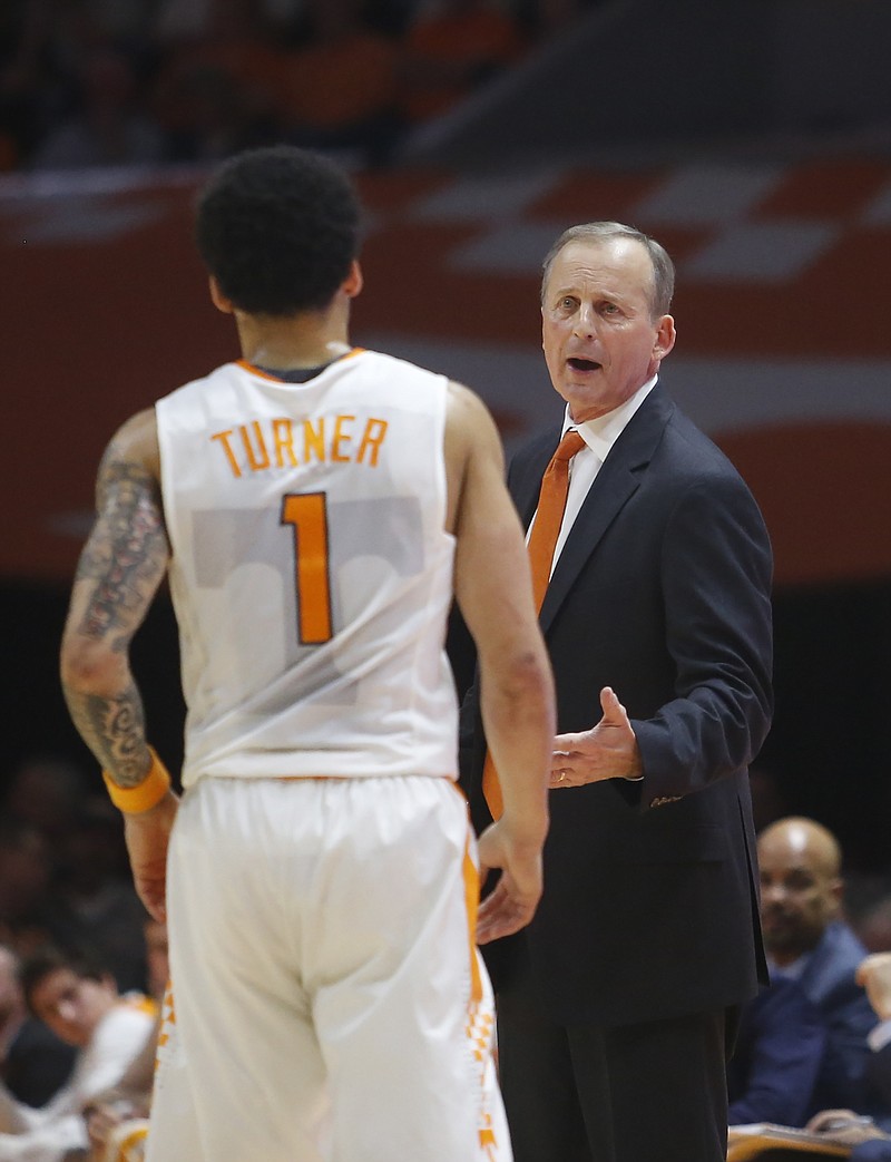 Tennessee coach Rick Barnes talks with guard Lamonte Turner (1) during the first half of the team's NCAA college basketball game against Florida on Wednesday, Feb. 21, 2018, in Knoxville, Tenn. (AP Photo/Crystal LoGiudice)