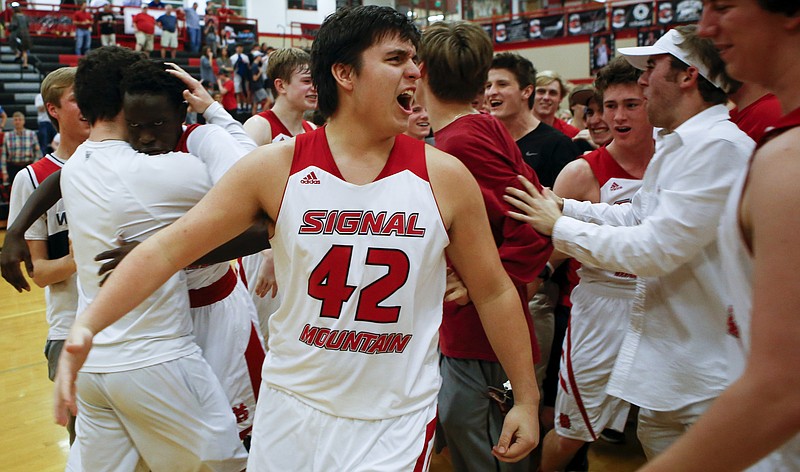 Isaac Bird (42) and Signal Mountain celebrate with the student section after defeating Sequoyah 44-42 during the Region 3-AA quarterfinals at Signal Mountain Middle/High School on Friday, Feb. 23, 2018 in Signal Mountain, Tenn.
