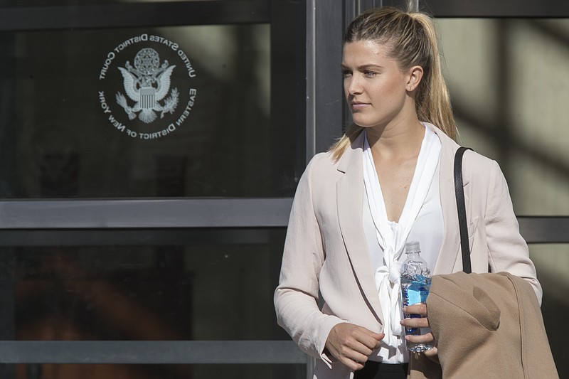 
              Tennis star Eugenie Bouchard leaves Brooklyn Federal court, Wednesday, Feb. 21, 2018, in New York. Bouchard testified during her negligence lawsuit against the United States Tennis Association that a wet floor caused her to slip and fall inside a locker room at the 2015 U.S. Open. (AP Photo/Mary Altaffer)
            