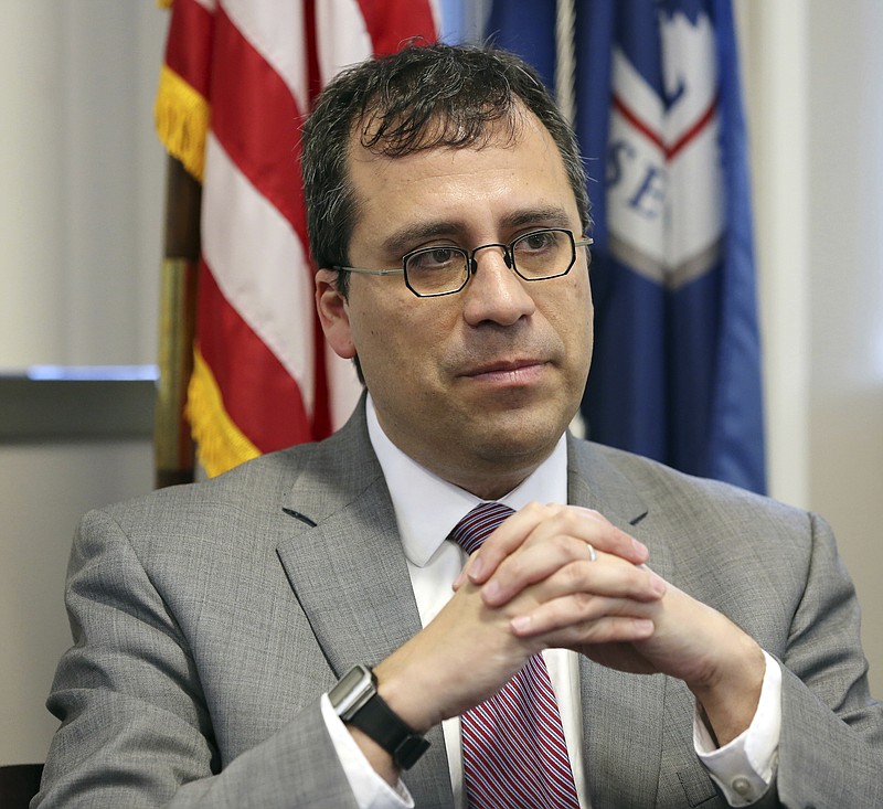 FILE- This Dec. 13, 2017, file photo shows L. Francis Cissna, director of U.S. Citizenship and Immigration Services, during an interview in his office in downtown Los Angeles. 