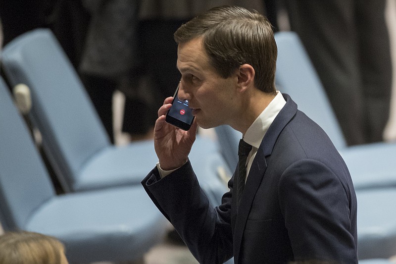 
              Jared Kushner takes a phone call before a Security Council meeting on the situation in Middle East, Tuesday, Feb. 20, 2018 at United Nations headquarters. (AP Photo/Mary Altaffer)
            