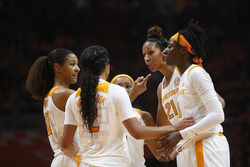 Tennessee guard Jaime Nared, far left, and center Mercedes Russell (21) — along with forward Kortney Dunbar, not pictured — will be honored this afternoon as the Lady Vols host South Carolina on senior day.