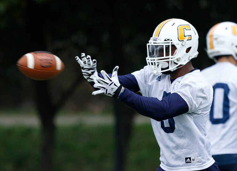 Wide receiver Bingo Morton runs a passing drill during the UTC football team's first spring practice at Scrappy Moore Field on Saturday, Feb. 24, 2018, in Chattanooga, Tenn. 