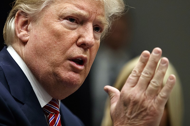 In this Feb. 22, 2018, photo, President Donald Trump speaks during a meeting with state and local officials to discuss school safety in the Roosevelt Room of the White House in Washington. 