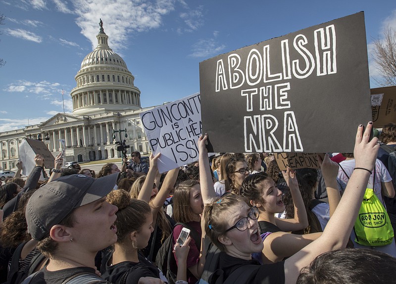In this Feb. 21, 2018, photo, school students from Montgomery County, Md., in suburban Washington, rally in solidarity with those affected by the shooting at Marjory Stoneman Douglas High School in Florida, at the Capitol in Washington. Member of Congress return from a 10-day recess under enormous pressure to respond to gun violence after the Parkland high school shooting. Despite a long list of legislative proposals, including many flowing from President Donald Trump, few ideas seem poised for passage. (AP Photo/J. Scott Applewhite, File)