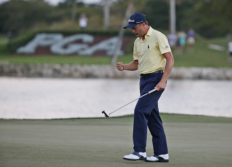 Justin Thomas celebrates after winning the Honda Classic golf tournament in a sudden-death playoff, Sunday, Feb. 25, 2018 in Palm Beach Gardens, Fla. (AP Photo/Wilfredo Lee)