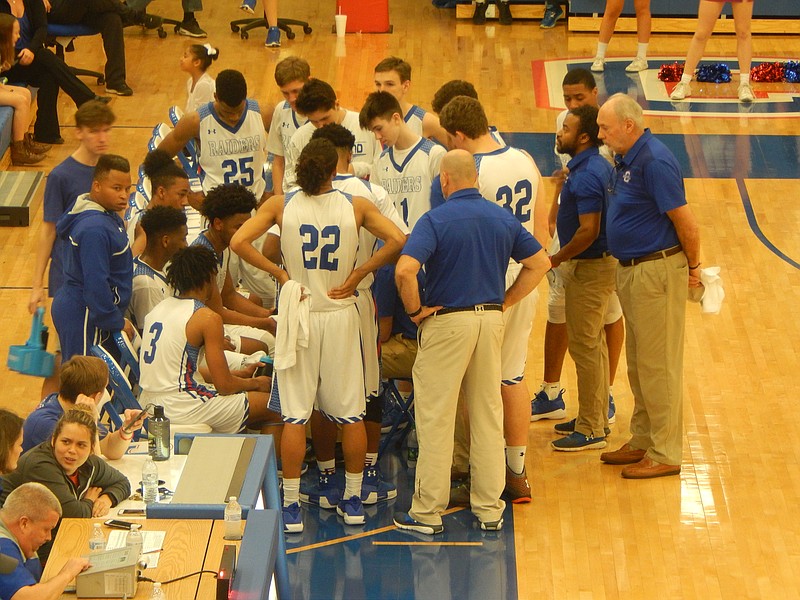 Cutline: Cleveland's boys' huddle up during a timeout in Saturday's Region 3-AAA quarterfinal at Cleveland. Cookeville defeated the Blue Raiders 70-68, ending their season at 22-5.