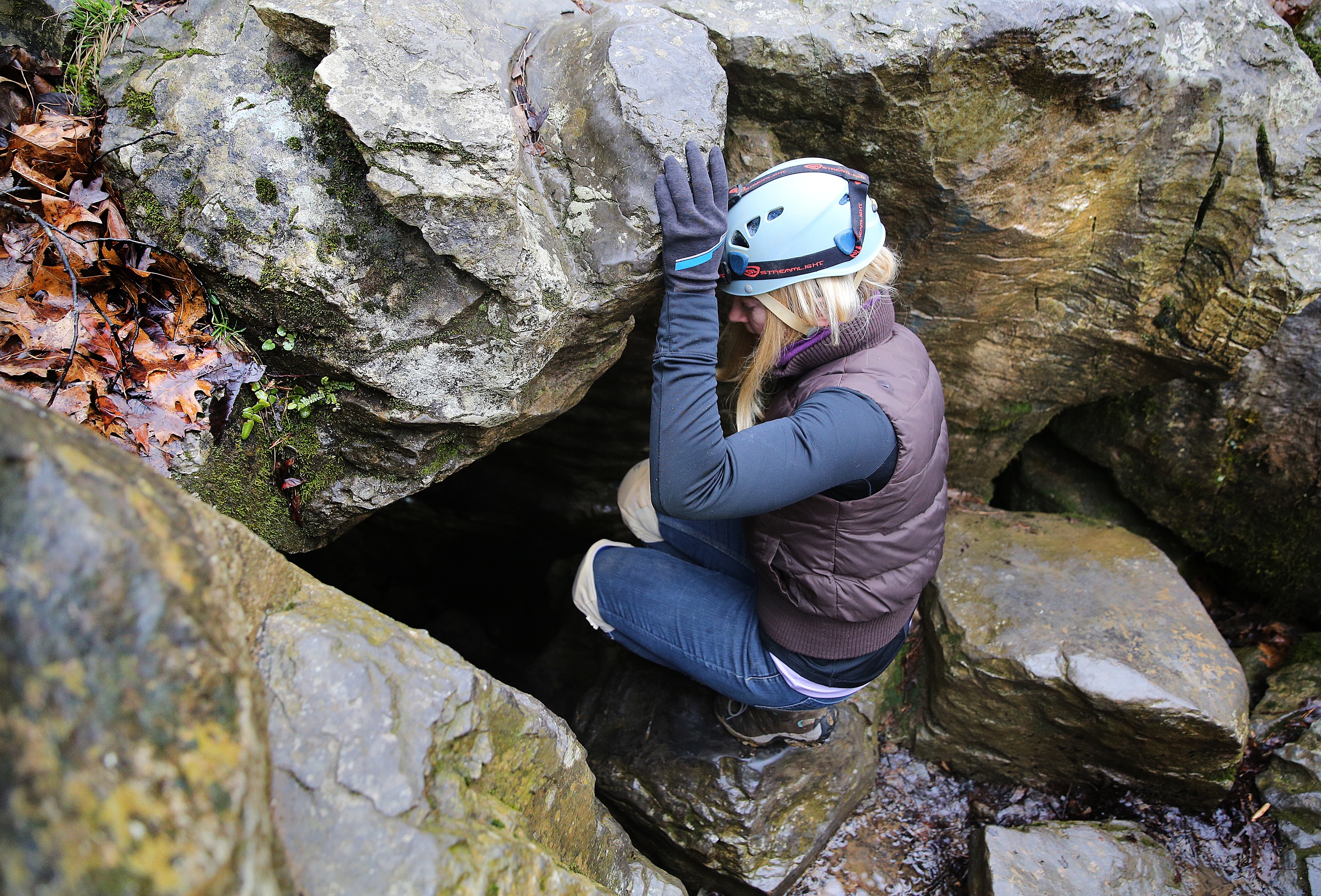 Sunny Montgomery steps into Pettyjohn's Cave in the Crockford-Pigeon Mountain Wildlife Management Area.