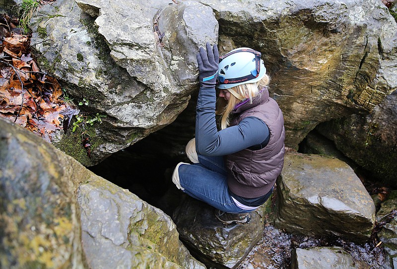 Sunny Montgomery steps into Pettyjohn's Cave in the Crockford-Pigeon Mountain Wildlife Management Area.