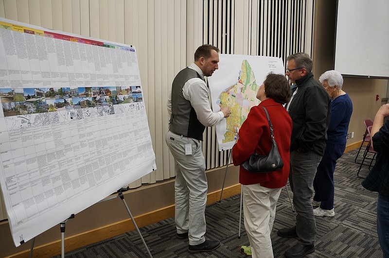 Travis Kazmierzak, a senior planner with the RPA, talks to attendees during a meeting to present the organization's draft plan for managing growth throughout the White Oak Mountain area on Feb. 15. (Staff photo by Myron Madden)