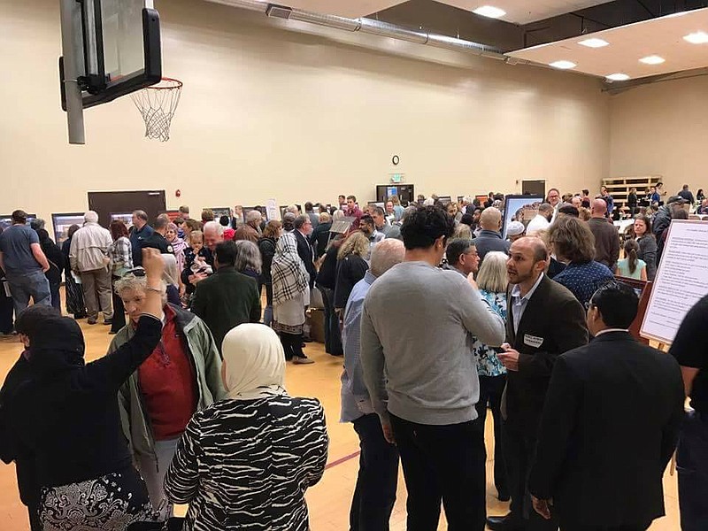 Booths in the Islamic Society of Greater Chattanooga gym educate attendees at the 2017 Meet Your Muslim Neighbor event on different topics related to Islam.