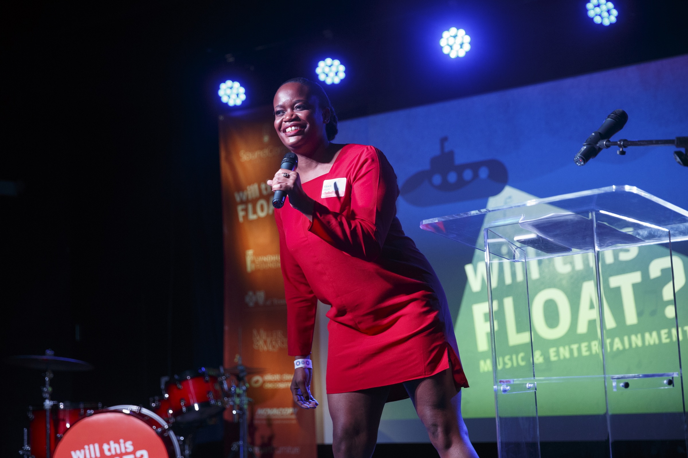 Alexis Willis talks on stage at the Will This Float? event held at the Revelry Room on Thursday, Dec. 10, 2015, in Chattanooga, Tenn. Ten finalists pitched business plans in the contest, and the selected winners were the company undaground in the best overall category, Southside Strings in best music & entertainment, and the CPR Lifewrap in best general business.