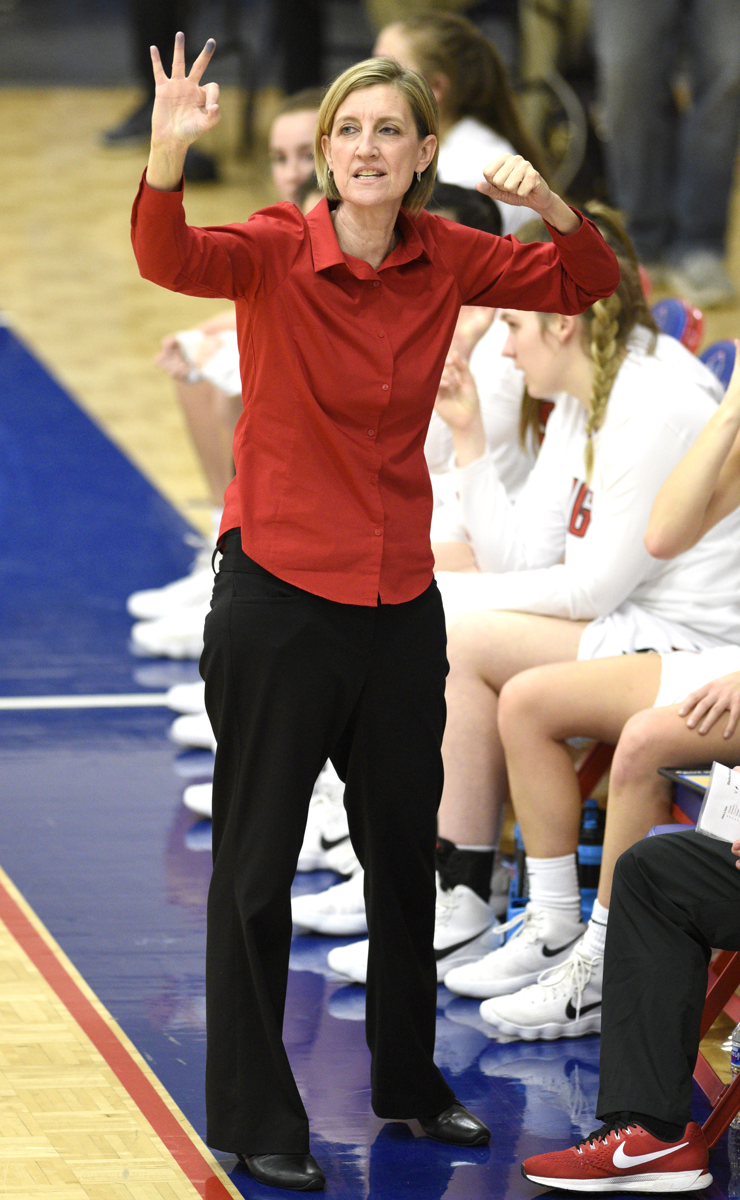 Signal head coach Kendra Bell signals to her team. The Meigs County Tigers played the Signal Mountain Eagles in the semi-final game of the girls's Region 3-AA TSSAA Tournament held at Red Bank High School on February 26, 2018.