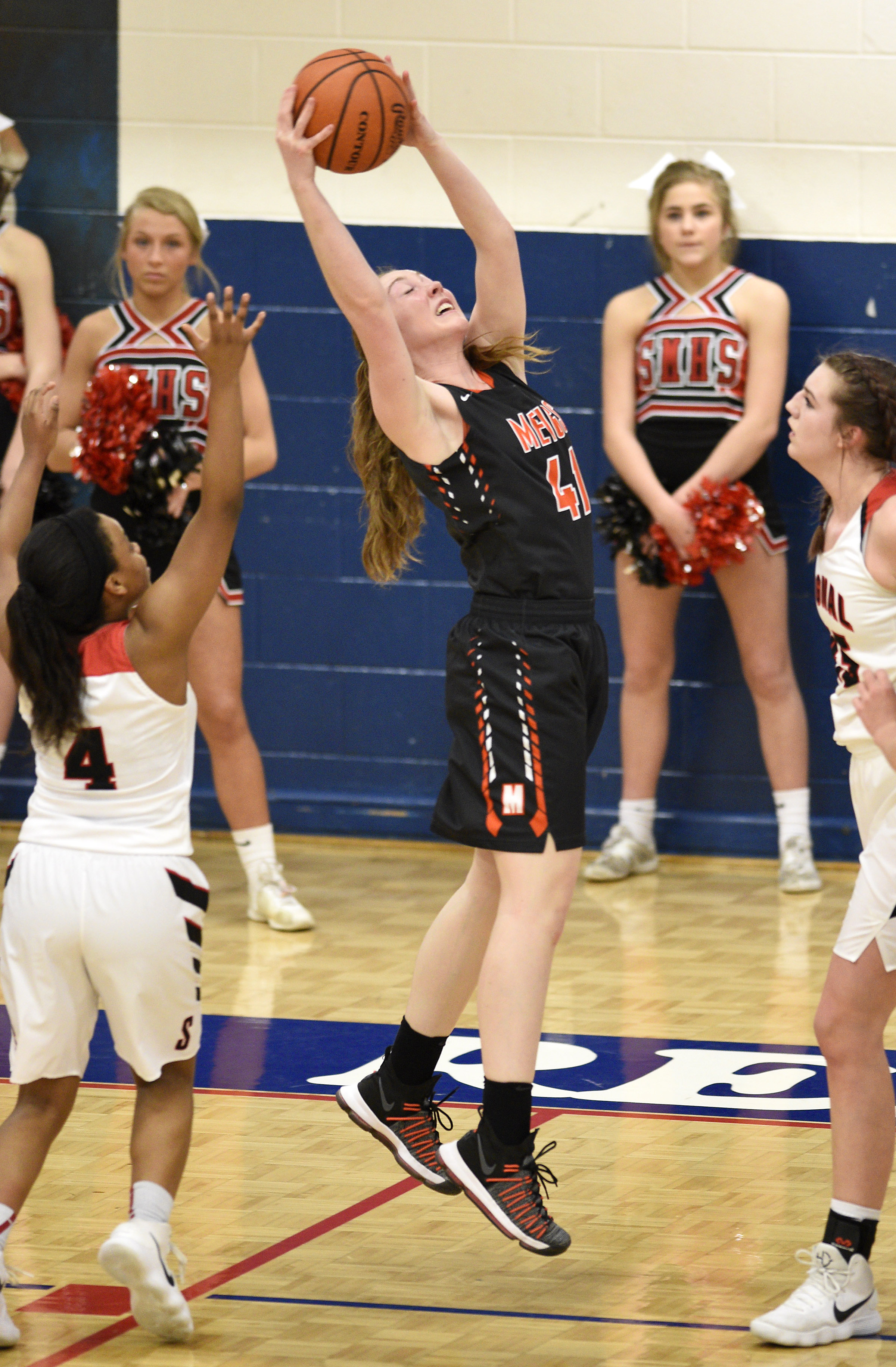 Jada Meadows (41) pull down a offensive rebound for Meigs. The Meigs County Tigers played the Signal Mountain Eagles in the semi-final game of the girls's Region 3-AA TSSAA Tournament held at Red Bank High School on February 26, 2018.