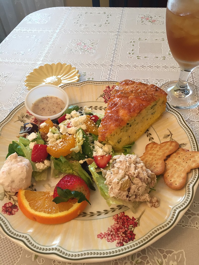 The broccoli-cheese quiche was served with a scoop of chicken salad, a small green salad, a mini fruit tart and two scones (not pictured).