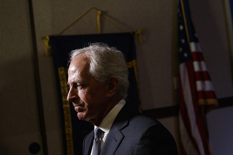 U.S. Sen. Bob Corker answers questions from reporters after speaking at a luncheon hosted by the Rotary Club of Cleveland. (Staff File Photo by Doug Strickland)