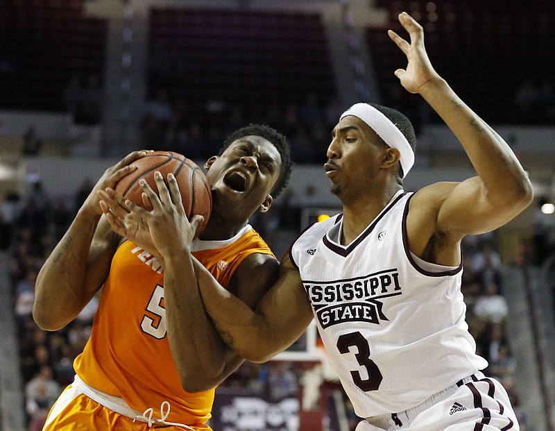 Tennessee forward Admiral Schofield (5) battles Mississippi State guard Xavian Stapleton (3) for a shot during the first half an NCAA college basketball game in Starkville, Miss., Tuesday, Feb. 27, 2018. (AP Photo/Rogelio V. Solis)