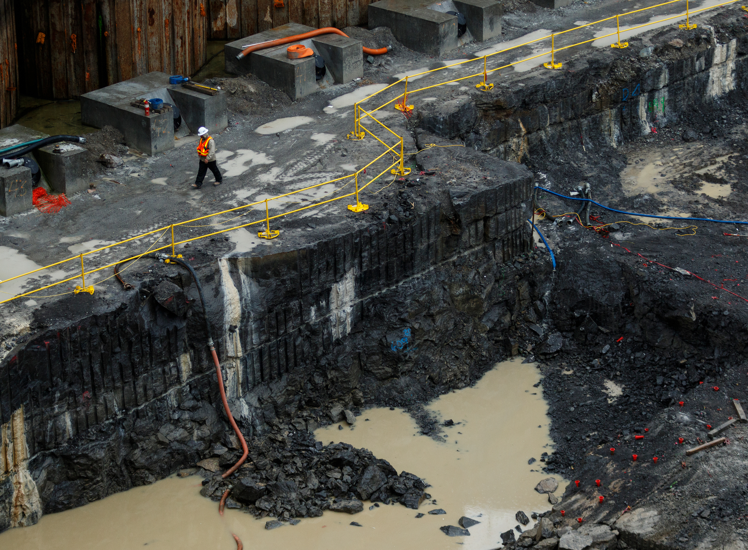 A construction worker walks atop the original riverbed level near excavation in the Chickamauga Dam Lock on Wednesday, Feb. 28, 2018, in Chattanooga, Tenn. The Inland Waterways Users Council took a tour of the lock.