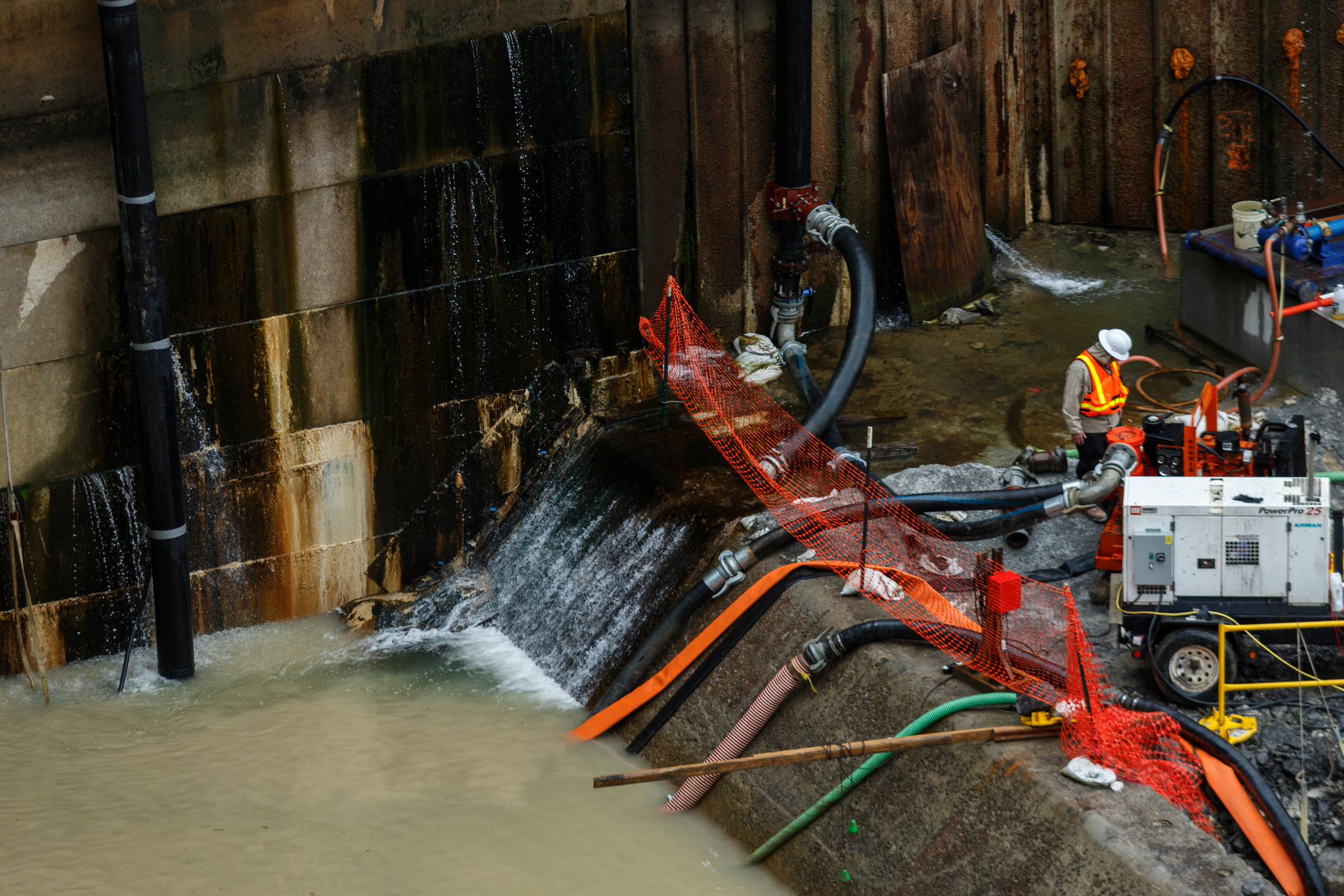 A construction worker stands near pumping equipment in the Chickamauga Dam Lock on Wednesday, Feb. 28, 2018, in Chattanooga, Tenn. The Inland Waterways Users Council took a tour of the lock.