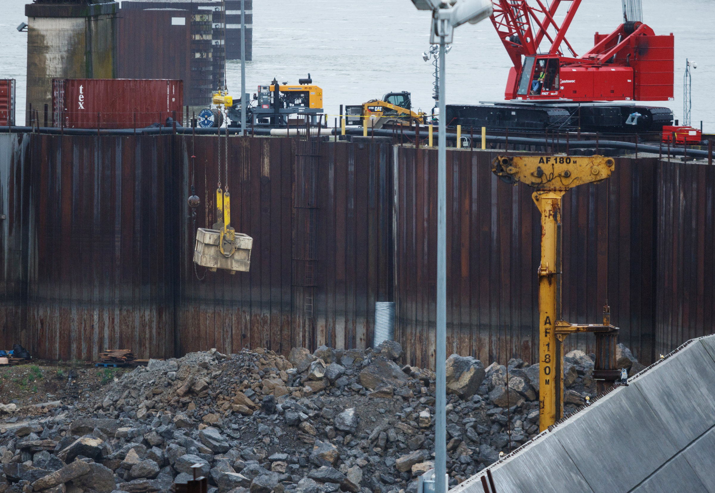 A crane moves debris out of the Chickamauga Dam Lock on Wednesday, Feb. 28, 2018, in Chattanooga, Tenn. The Inland Waterways Users Council took a tour of the lock.