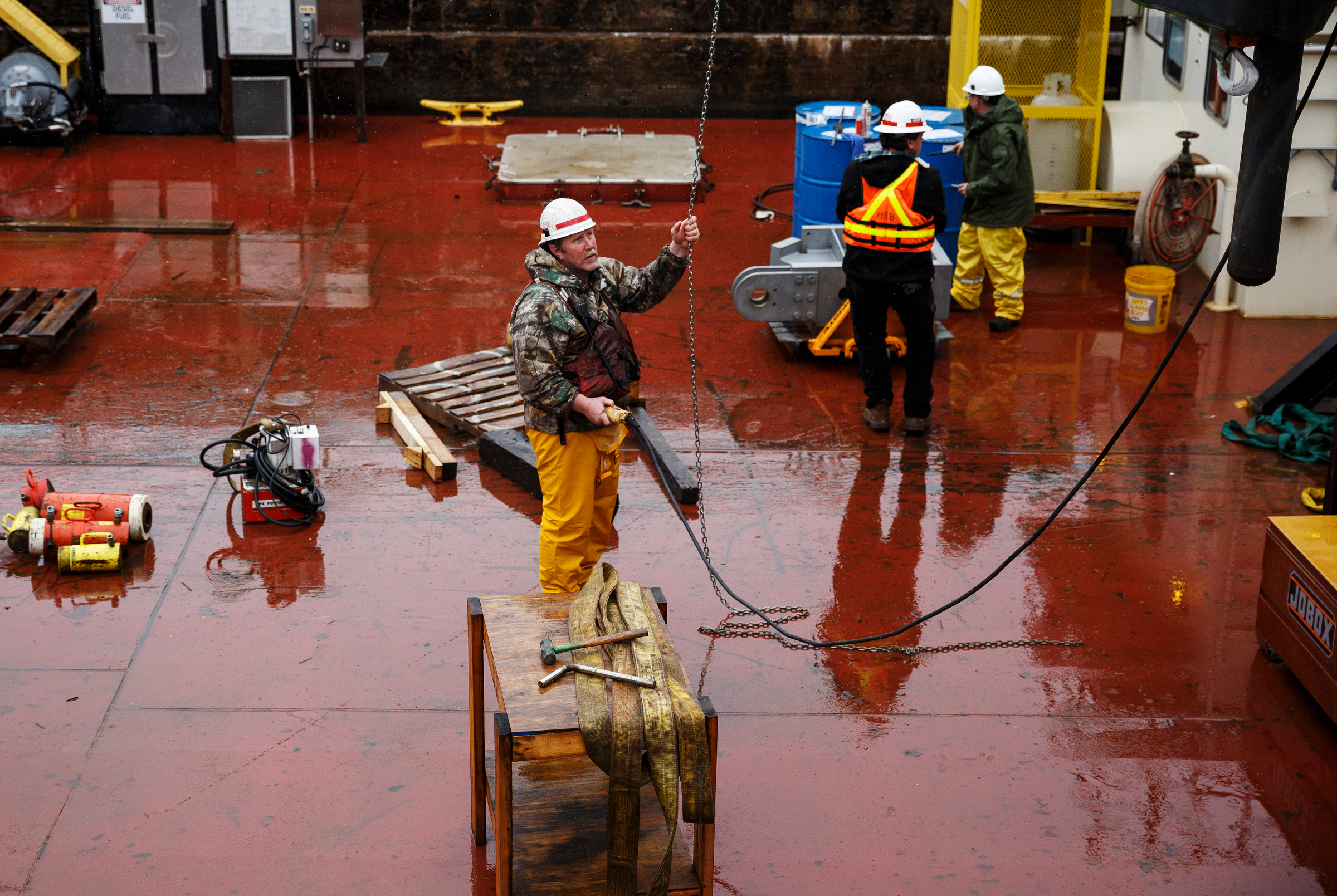 Workers use a crane to move equipment from the maintenance boat Binkley at the Chickamauga Dam Lock on Wednesday, Feb. 28, 2018, in Chattanooga, Tenn. The Inland Waterways Users Council took a tour of the lock.
