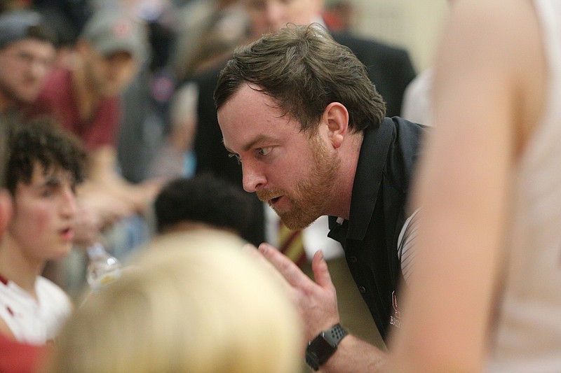 Christian Heritage boys' basketball coach Tyler Watkins talks to his team during a state tournament game against Mount Vernon last week. Christian Heritage lost its quarterfinal against Holy Innocents' on Wednesday night.