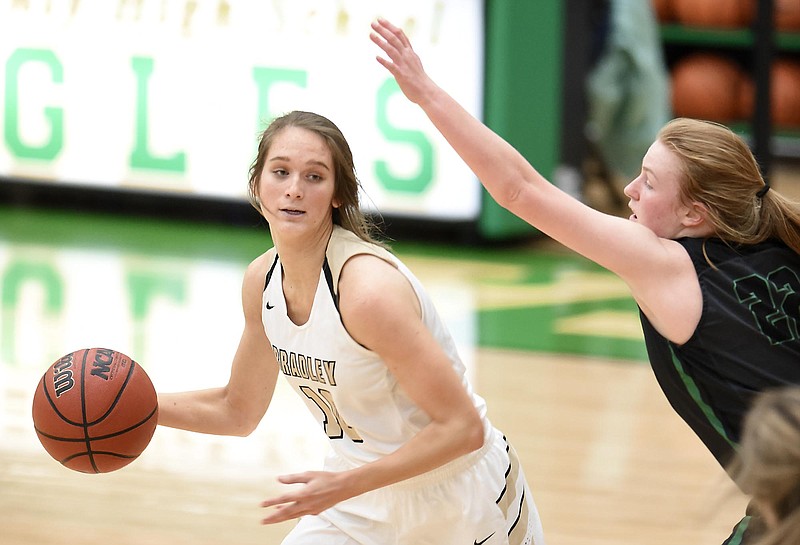 Bradley's Anna Roberts (10) looks for a open teammate while East Hamilton's Carli Zeh (22) defends.  The East Hamilton Lady Hurricanes met the Bradley Central Bears for the Region 3AAA TSSAA girls'  basketball championship on February 28, 2018