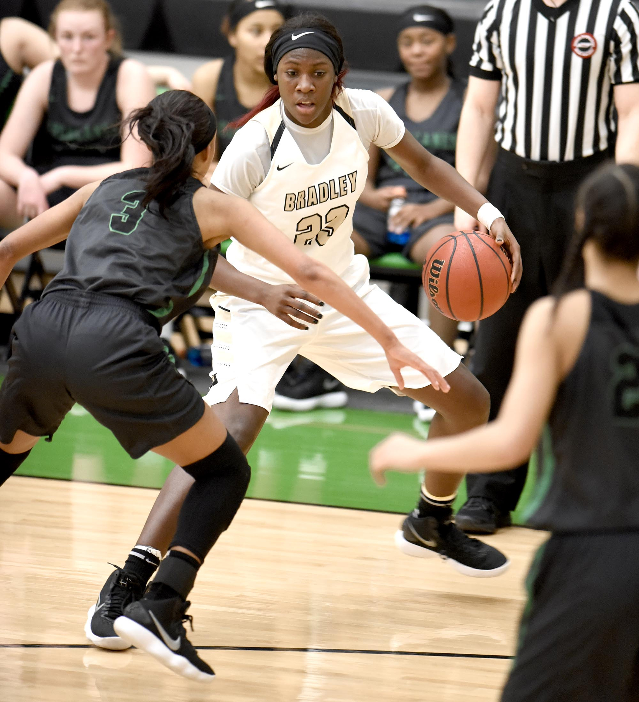 Bradley's Rhyne Howard (23) looks for an opening in the Hurricane defense, defending is East Hamilton's DeZah Lacy (3).  The East Hamilton Lady Hurricanes met the Bradley Central Bears for the Region 3AAA TSSAA girls'  basketball championship on February 28, 2018