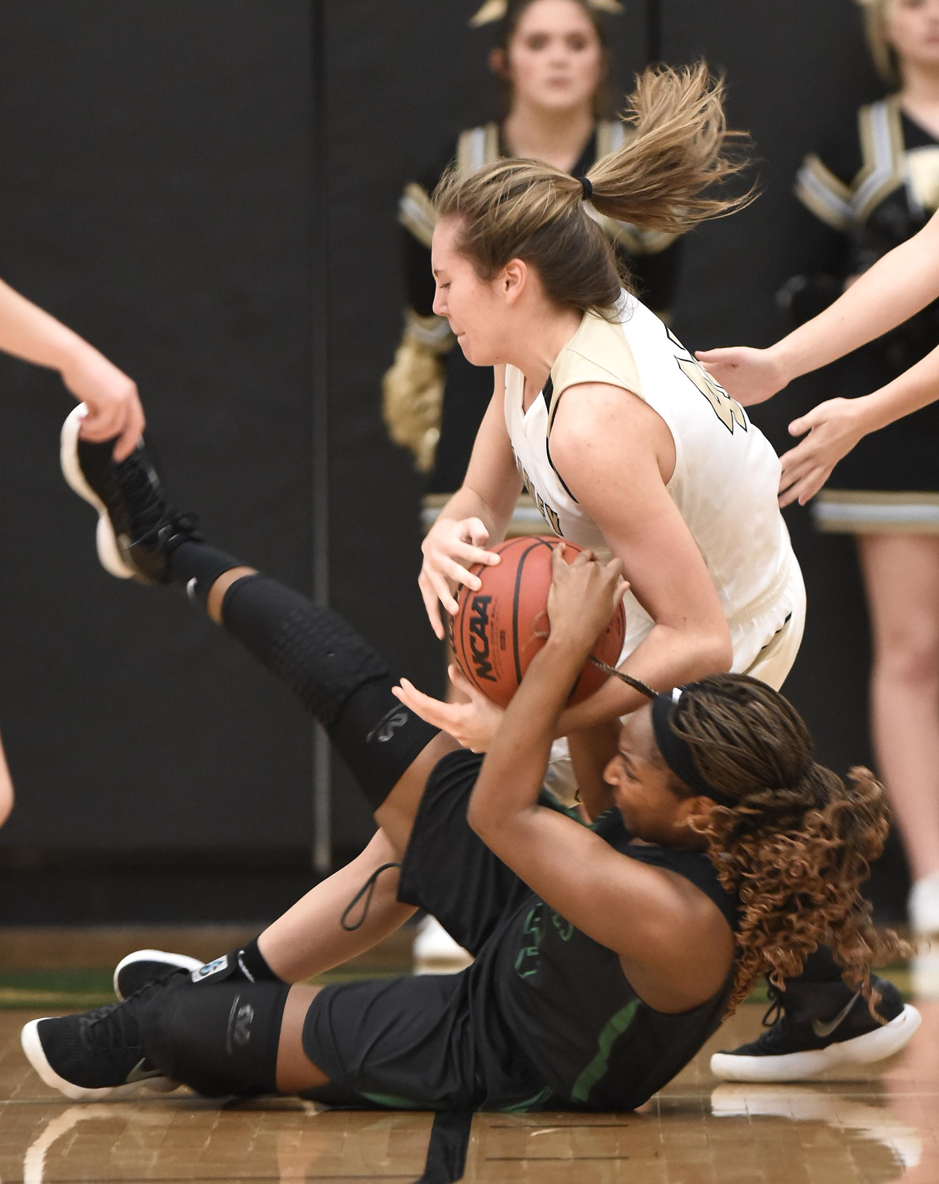 Bradley's Hannah Lombard (45) and East Hamilton's Eliziah Laboo (45) go to the floor as they fight for the ball.  The East Hamilton Lady Hurricanes met the Bradley Central Bears for the Region 3AAA TSSAA girls'  basketball championship on February 28, 2018