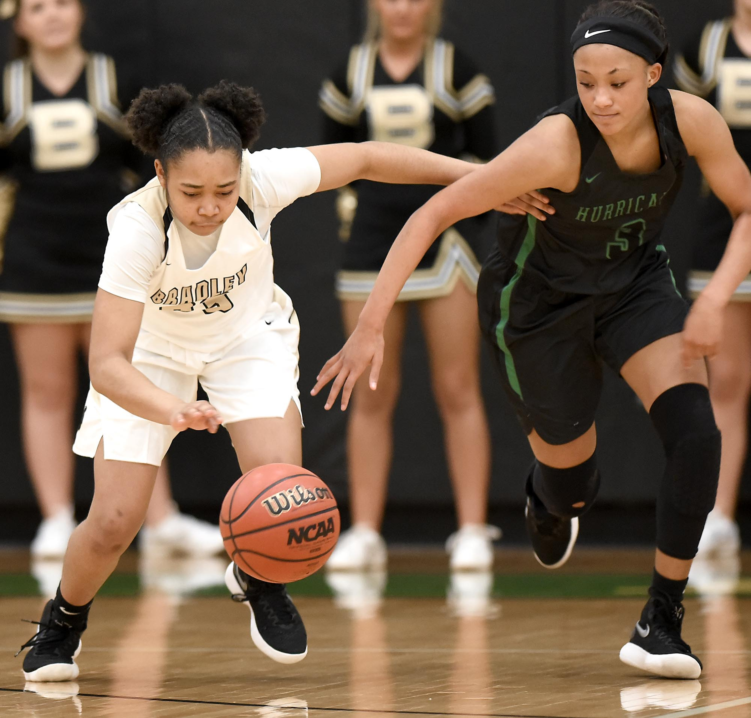 Bradley's Jamaryn Blair (33) beats East Hamilton's DeZah Lacy (3) to a loose ball.  The East Hamilton Lady Hurricanes met the Bradley Central Bears for the Region 3AAA TSSAA girls'  basketball championship on February 28, 2018