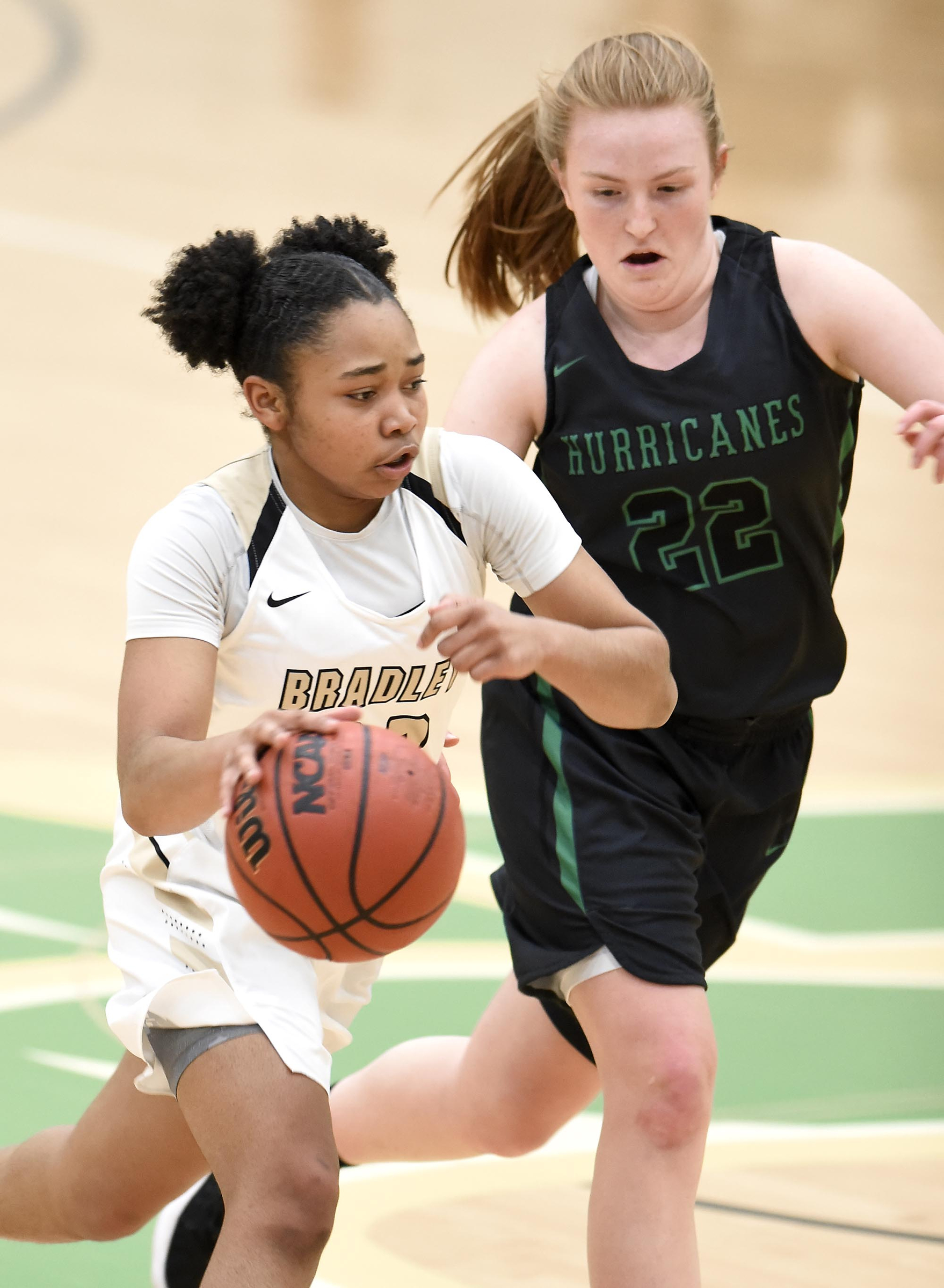 Bradley's Jamaryn Blair (33) brings the ball up past East Hamilton's Carli Zeh (22).  The East Hamilton Lady Hurricanes met the Bradley Central Bears for the Region 3AAA TSSAA girls'  basketball championship on February 28, 2018