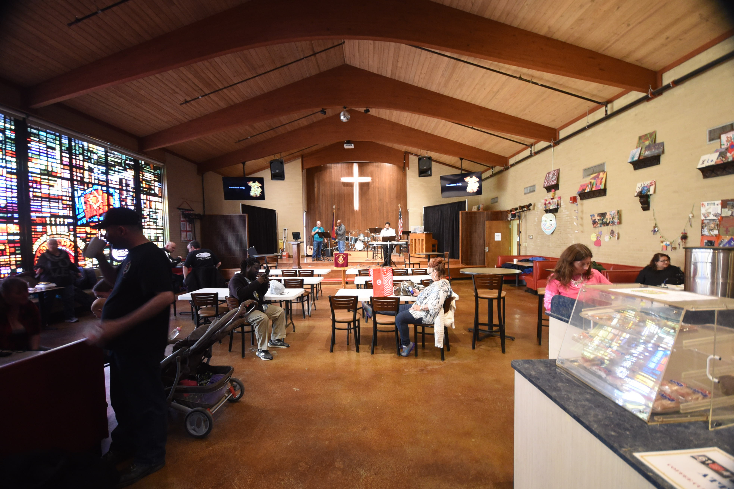 A sparse crowd relaxes inside The Salvation Army dining area Tuesday as winter temperatures soar beyond the norm in Chattanooga. The organization celebrates its 125th anniversary this year.