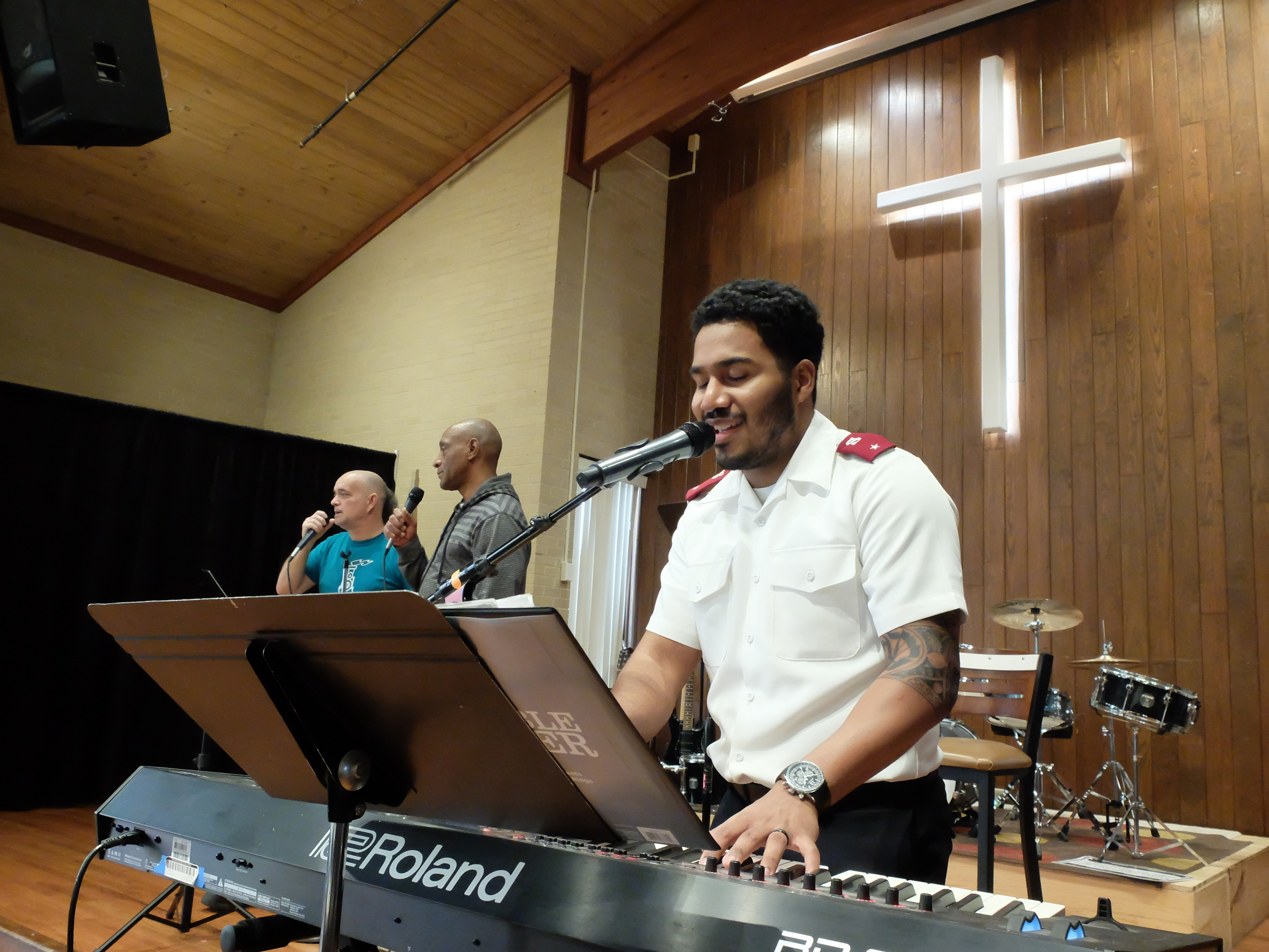 Salvation Army Lt. James Harvin, corps officer of the 614 Corps, plays piano and sings during a worship hour Tuesday with the help of Keim Shirley and Danny Mingo. The organization celebrates its 125th anniversary in Chattanooga this year.