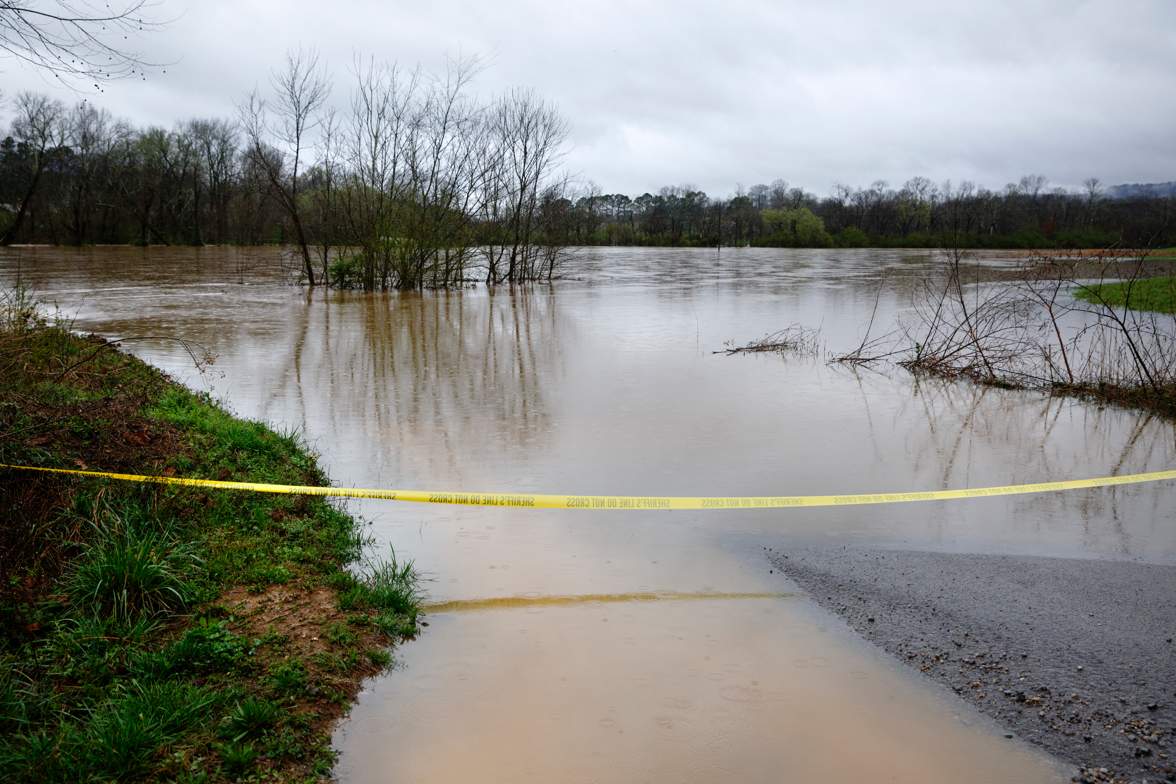 Creek road is made impassible by floodwaters from Lookout Creek after heavy rainfall caused flooding throughout the region Thursday, March 1, 2018, in Wildwood, Ga.