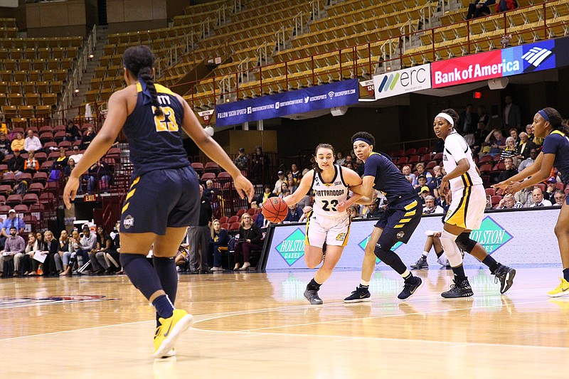 Brooke Burns (23) set a UTC women's scoring record for the Southern Conference tournament with 36 points in Thursday's double-overtime loss to UNC Greensboro in Asheville, N.C. (Photo: Dale Rutemeyer)
