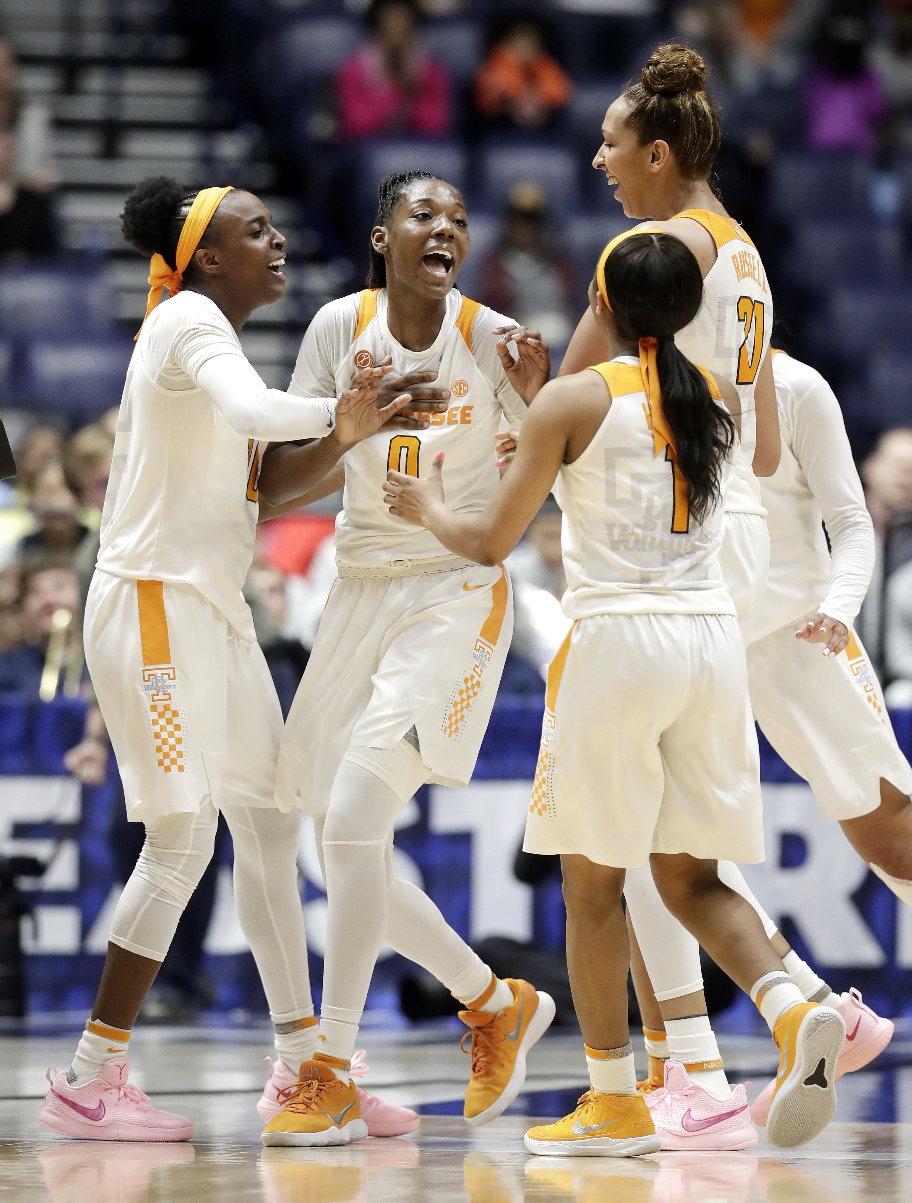 Tennessee's Rennia Davis (0) celebrates with teammates after shooting the winning three-point basket against Auburn with one second remaining in the fourth quarter of an NCAA college basketball game at the women's Southeastern Conference tournament Thursday, March 1, 2018, in Nashville, Tenn. Tennessee won 64-61. (AP Photo/Mark Humphrey)