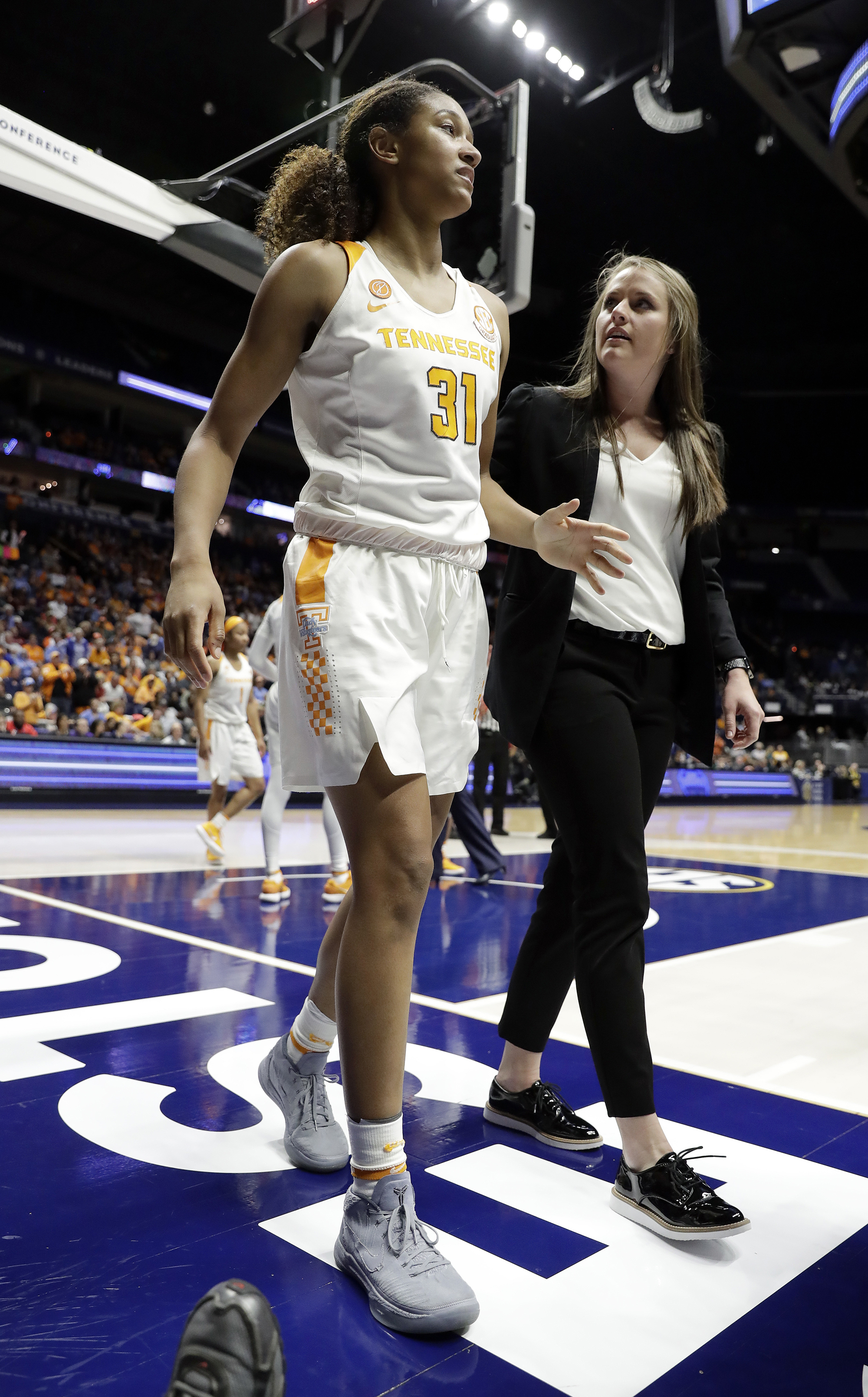 Tennessee's Jaime Nared (31) leaves the court after taking a hard fall against Auburn in the second half of an NCAA college basketball game at the women's Southeastern Conference tournament Thursday, March 1, 2018, in Nashville, Tenn. (AP Photo/Mark Humphrey)