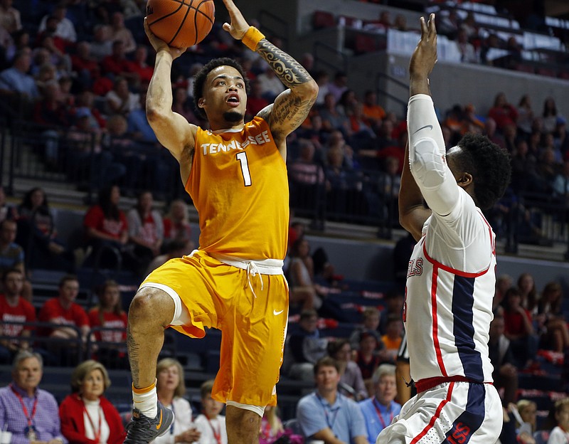 Tennessee guard Lamonte Turner (1) shoots in front of a Mississippi defender during the first half of an NCAA college basketball game in Oxford, Miss., Saturday, Feb. 24, 2018. (AP Photo/Rogelio V. Solis)