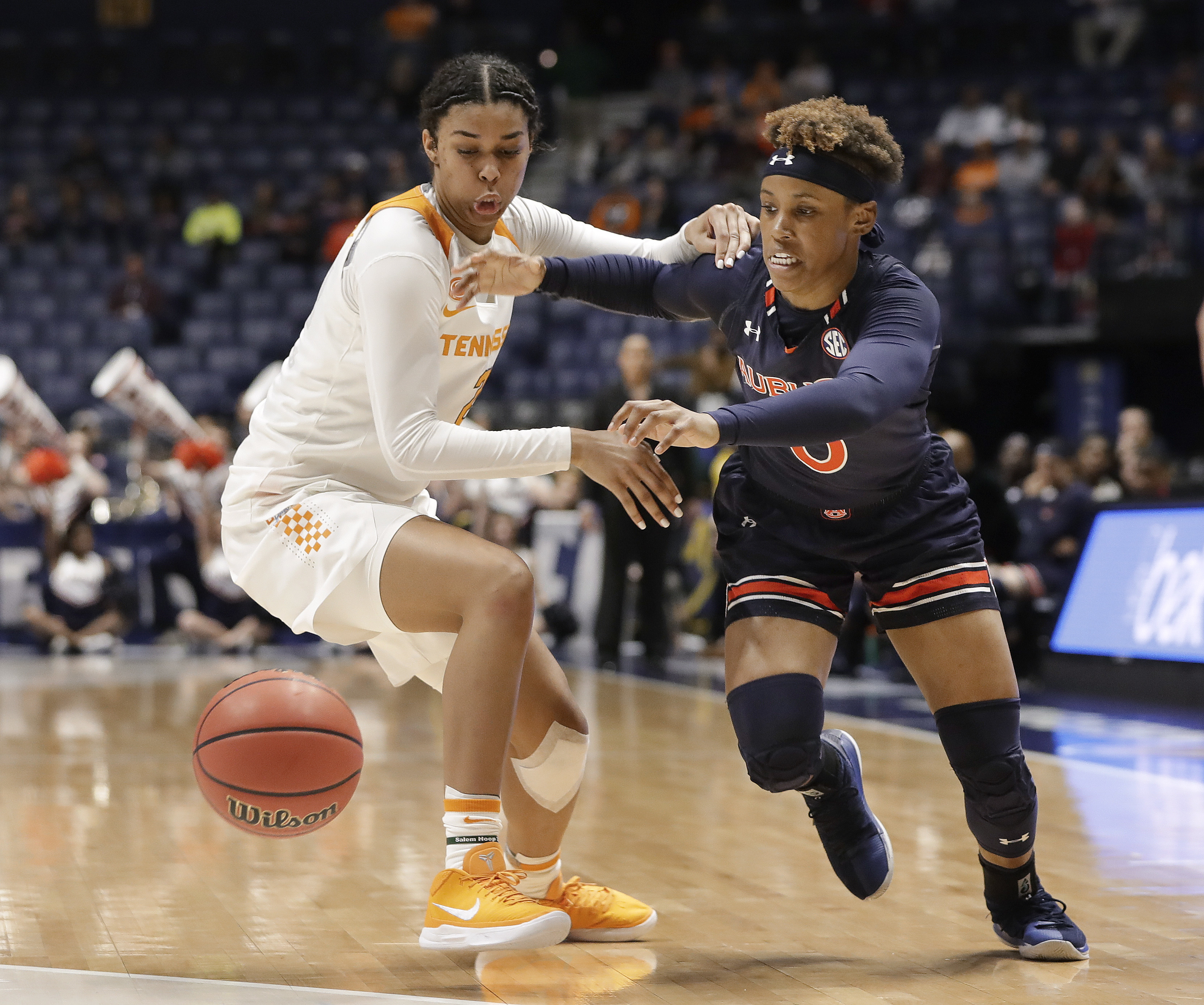 Tennessee guard Evina Westbrook, left, and Auburn guard Daisa Alexander chase after the ball in the first half of an NCAA college basketball game at the women's Southeastern Conference tournament Thursday, March 1, 2018, in Nashville, Tenn. (AP Photo/Mark Humphrey)