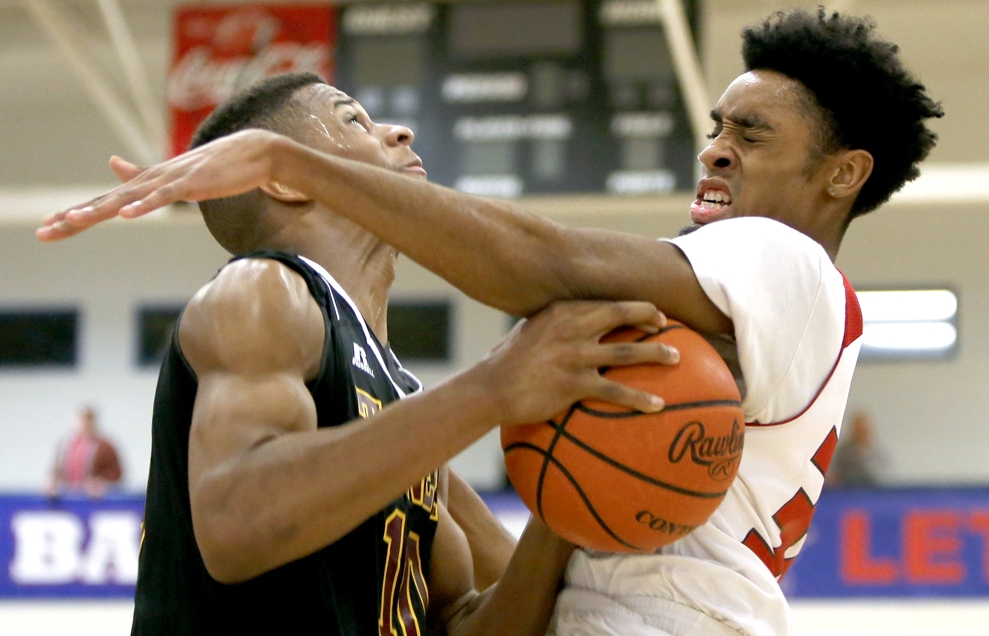 Signal Mountain's Jarren Radden (30) fouls Tyner's Solomon Bridgeman (10) during the Region 3-AA final at Susan Ingram Thurman Gymnasium on the campus of Red Bank High School on Thursday, March 1, 2018 in Red Bank, Tenn.