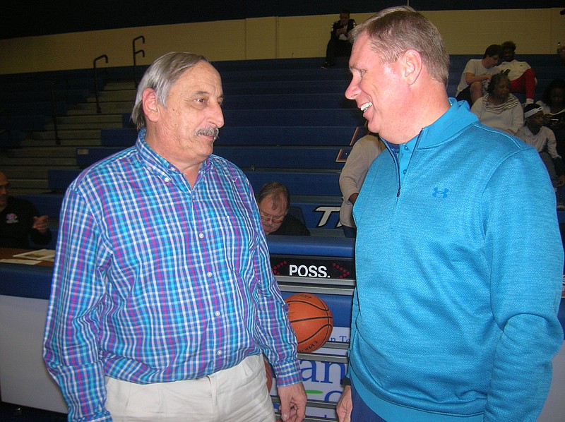 TCCAA commissioner Foster Chason, right, chats with NJCAA Region VII men's director Bobby Hudson at the state/region basketball tournament at Chattanooga State, where Chason worked for 30 years.