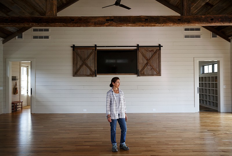 Karen Persinger poses for a portrait in the yoga center at Rising Fawn Gardens on Friday, Feb. 23, 2018, in Rising Fawn, Tenn. Rising Fawn Gardens offers a yoga studio and corporate retreats in addition to growing wheat and herbs, but the only available internet access is via satellite, which has limited capability and speed compared to other broadband offerings.