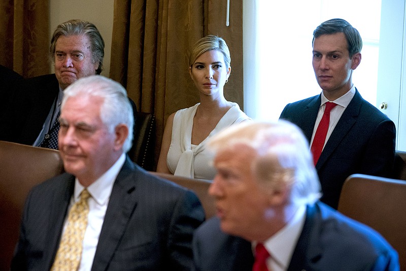 Ivanka Trump and her husband, White House Senior Adviser Jared Kushner, look on as President Donald Trump holds a Cabinet meeting last July. (Doug Mills/The New York Times)