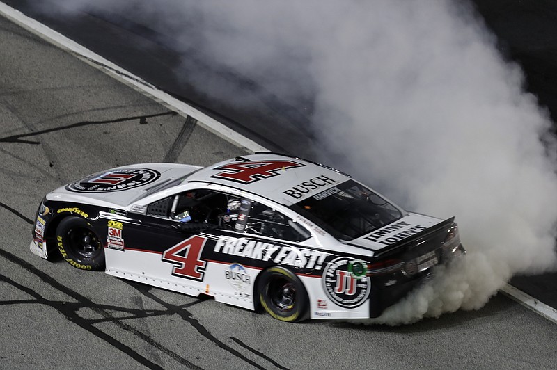 Monster Energy NASCAR Cup Series driver Kevin Harvick (4) does a burnout after winning the NASCAR Cup Series auto race at Atlanta Motor Speedway in Hampton, Ga., on Sunday, Feb. 25, 2018. (AP Photo/Paul Abell)