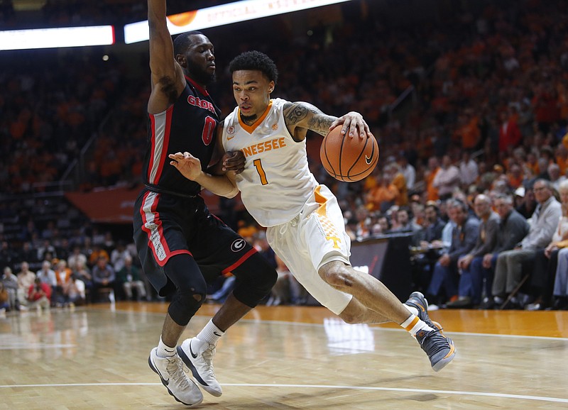 Tennessee guard Lamonte Turner (1) drives the ball toward the basket as he is defended by Georgia guard William Jackson II (0) in the second half of an NCAA college basketball game Saturday, March 3, 2018, in Knoxville, Tenn. (AP Photo/Crystal LoGiudice)