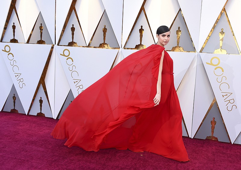 Sofia Carson arrives at the Oscars on Sunday, March 4, 2018, at the Dolby Theatre in Los Angeles. (Photo by Jordan Strauss/Invision/AP)